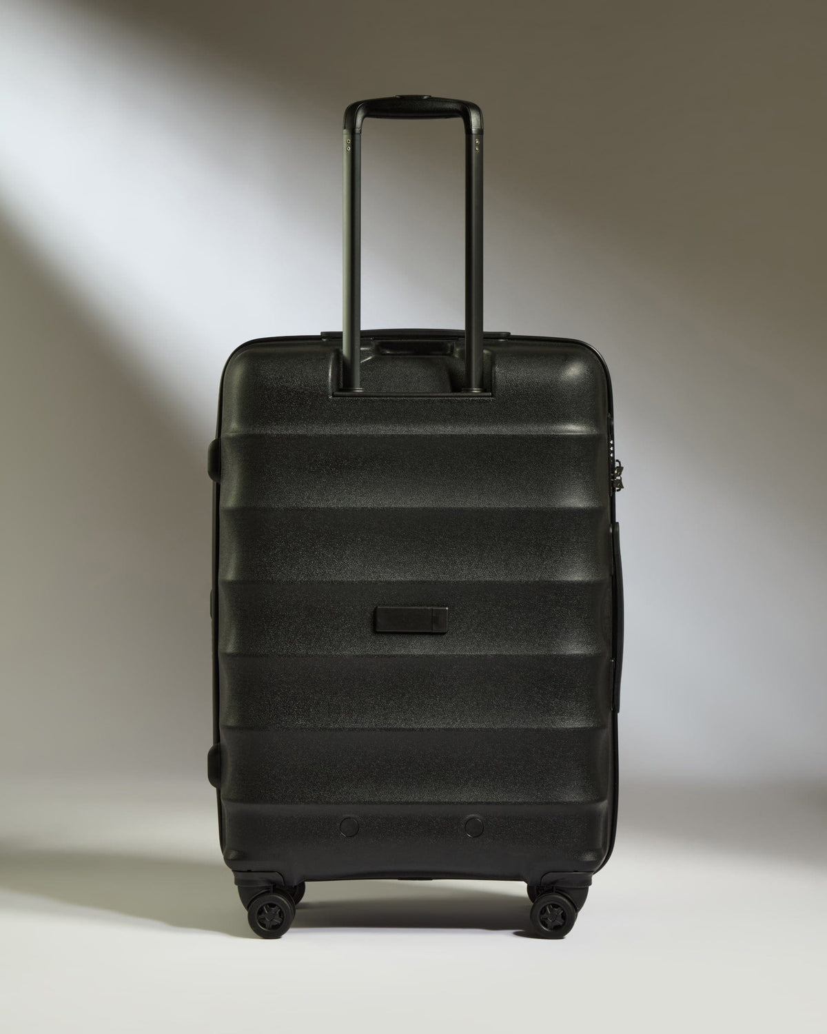Antler Luggage - Medium Suitcase in Black - Juno - Hard Suitcase Medium Suitcase in Black - Juno | Checked Luggage & Medium Suitcases