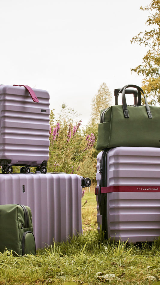 a group of luggage on wheels