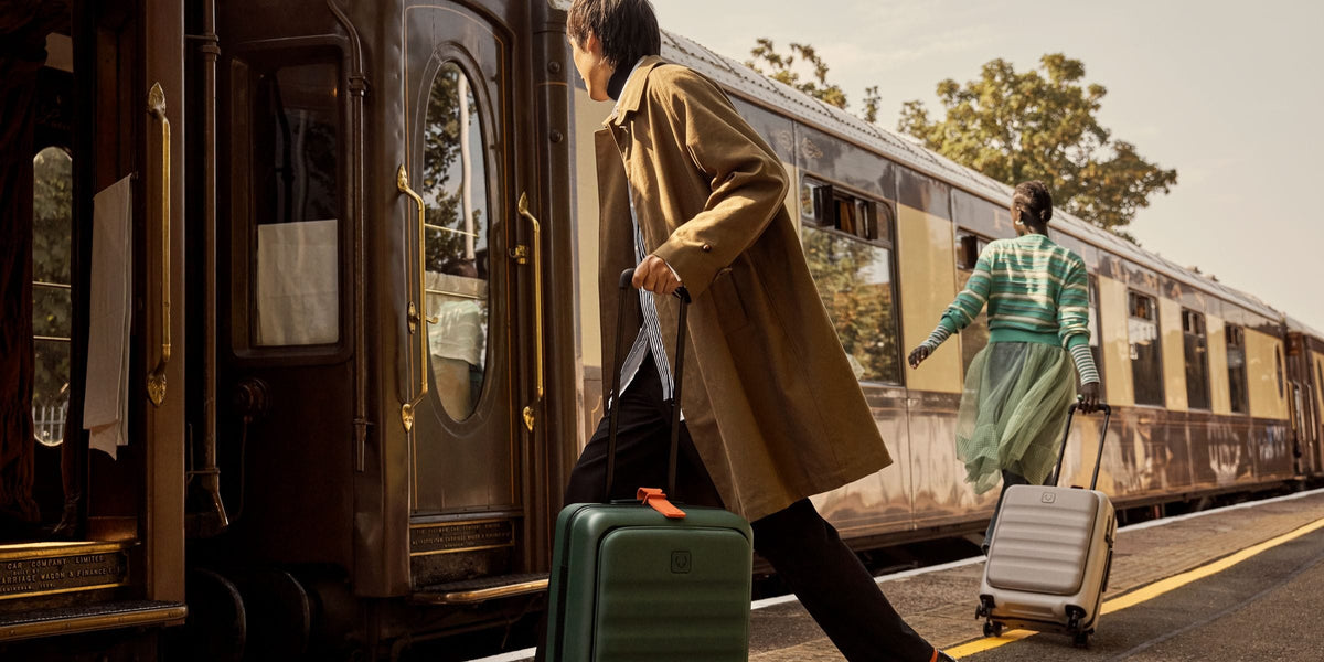 a man pulling a suitcase