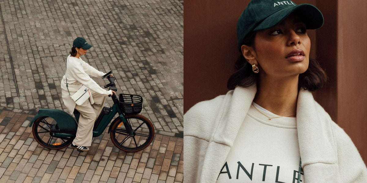 a woman in a white jacket and green hat