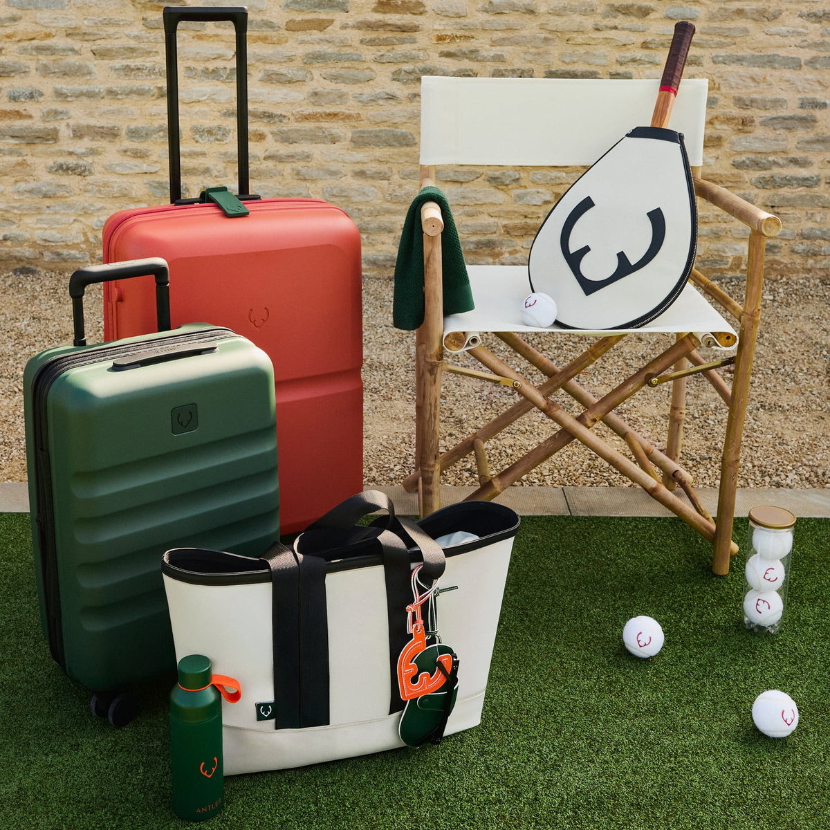 a group of luggage and a chair