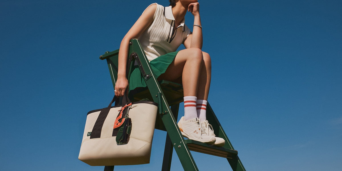 a woman sitting on a ladder