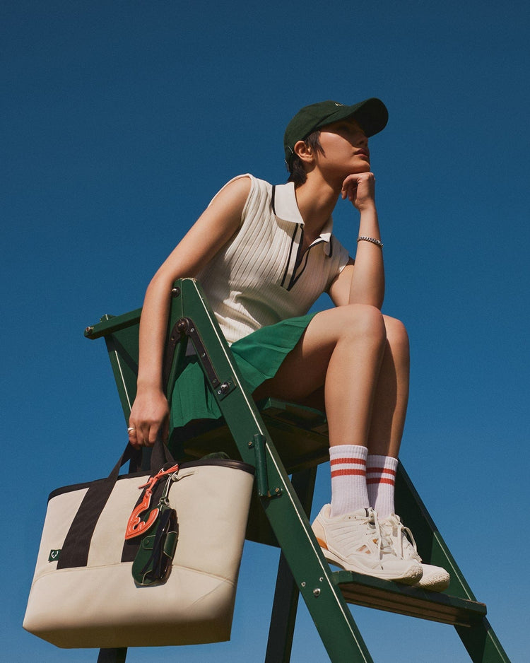 a woman sitting on a ladder