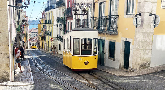 a yellow trolley on a street