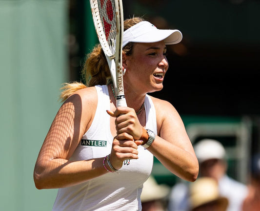 a woman holding a tennis racket