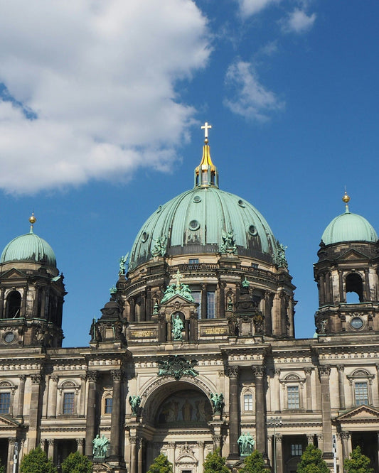 a large building with a green dome