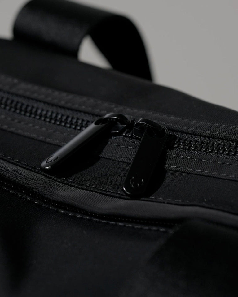 a zipper on a black bag