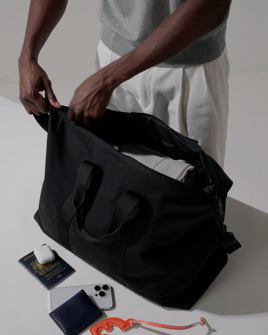 a person holding a bag