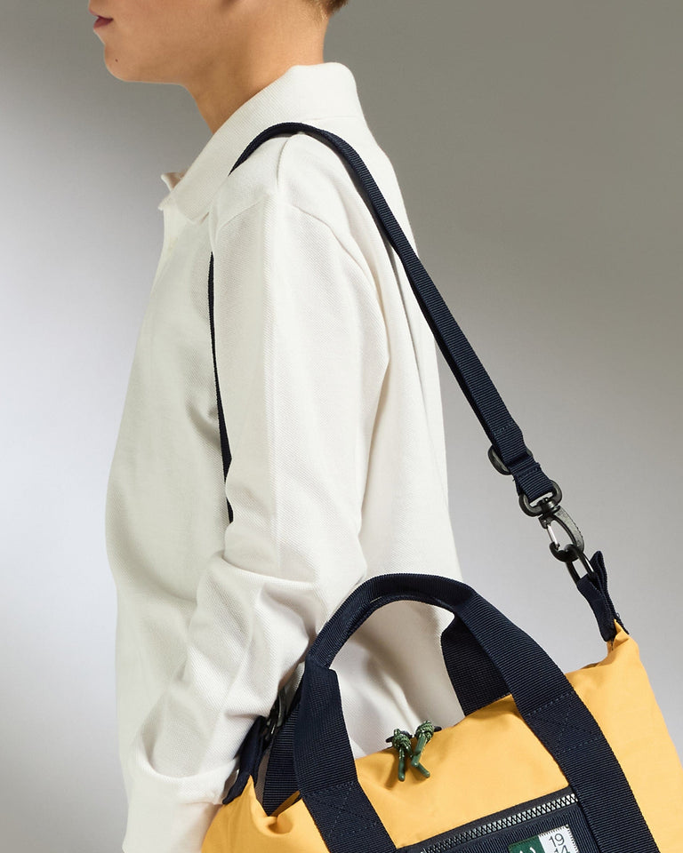 a person carrying a yellow and black bag