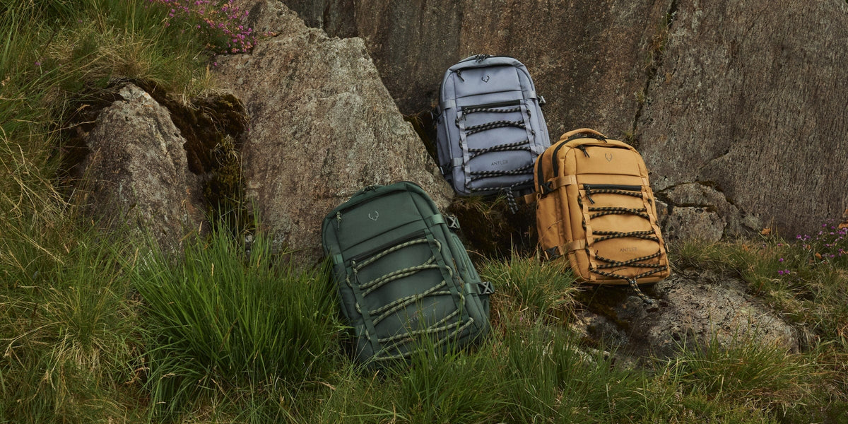 a group of backpacks on rocks