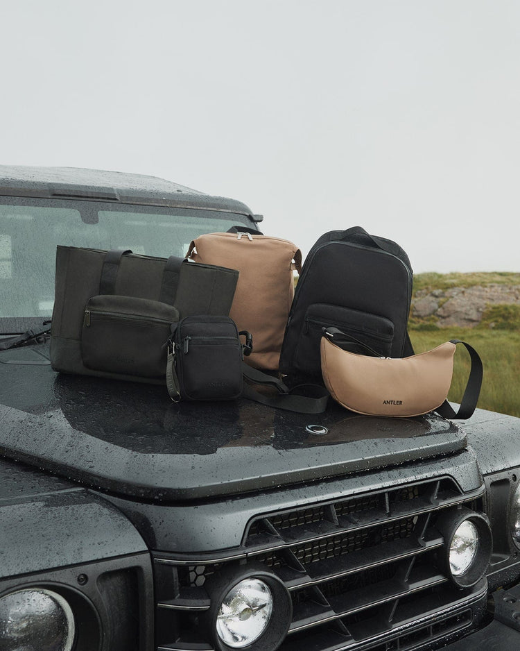 a group of bags on a car hood