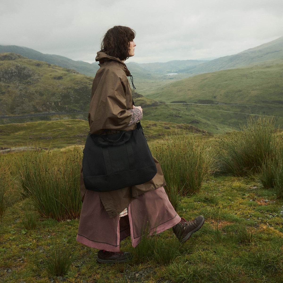 a woman walking in a field