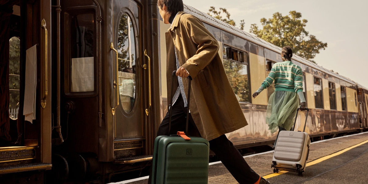 a man pulling a suitcase