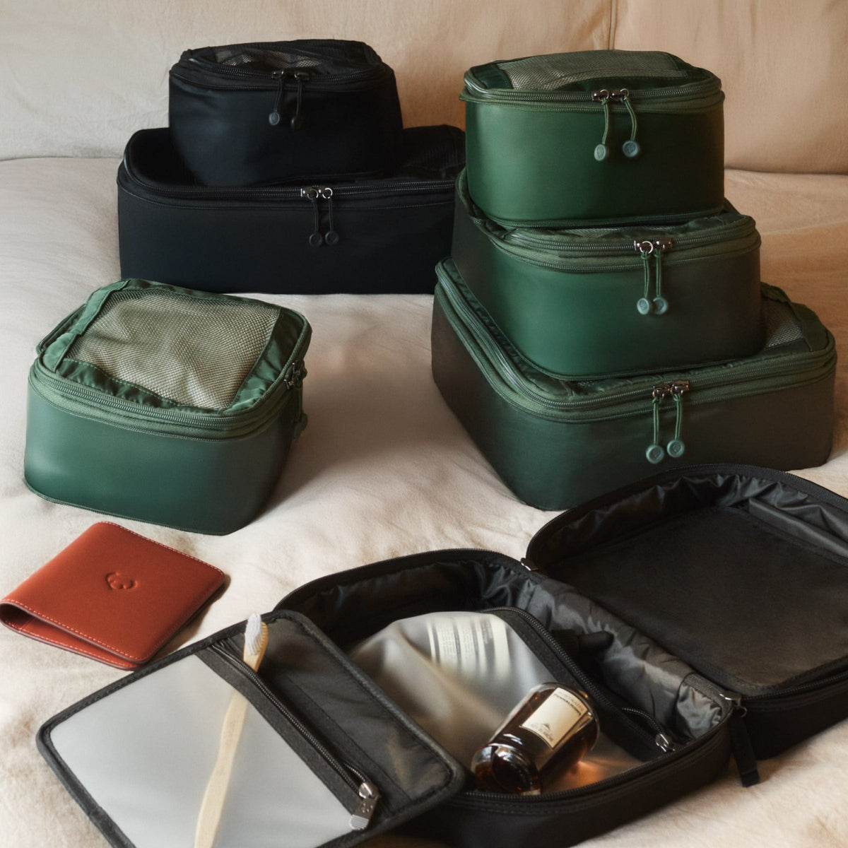 a group of luggage on a bed