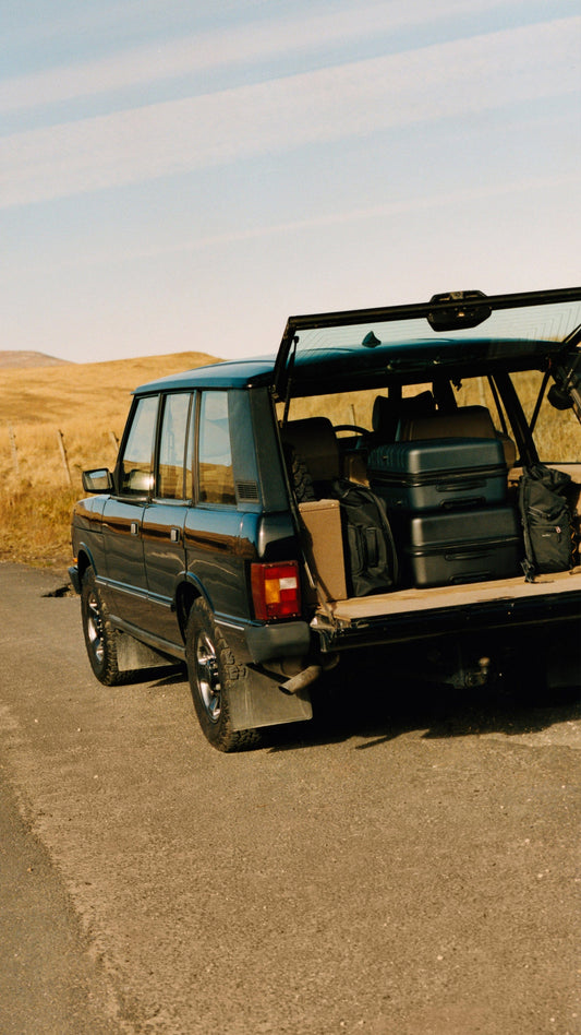 a car with luggage in the back of it