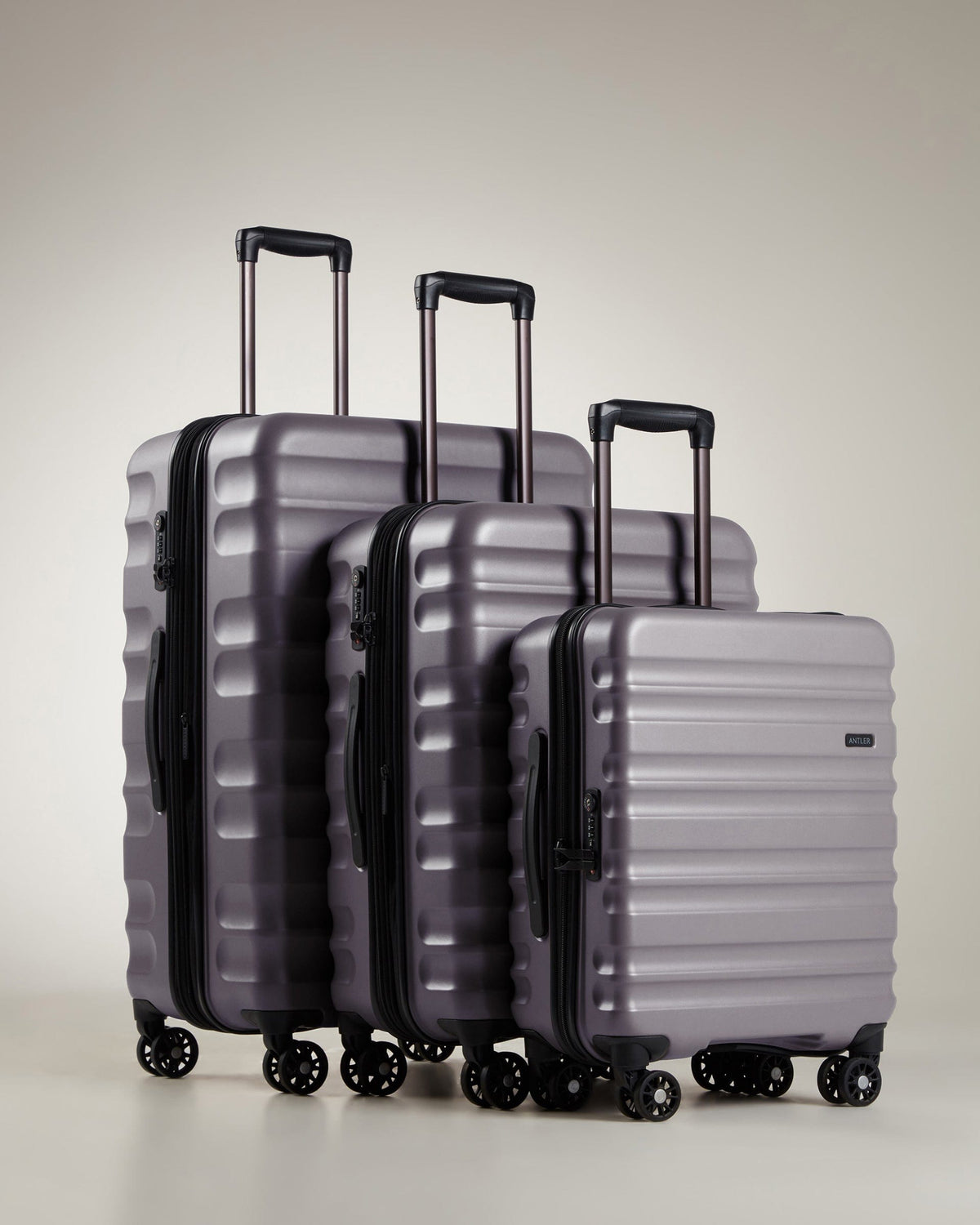 a group of luggage on wheels