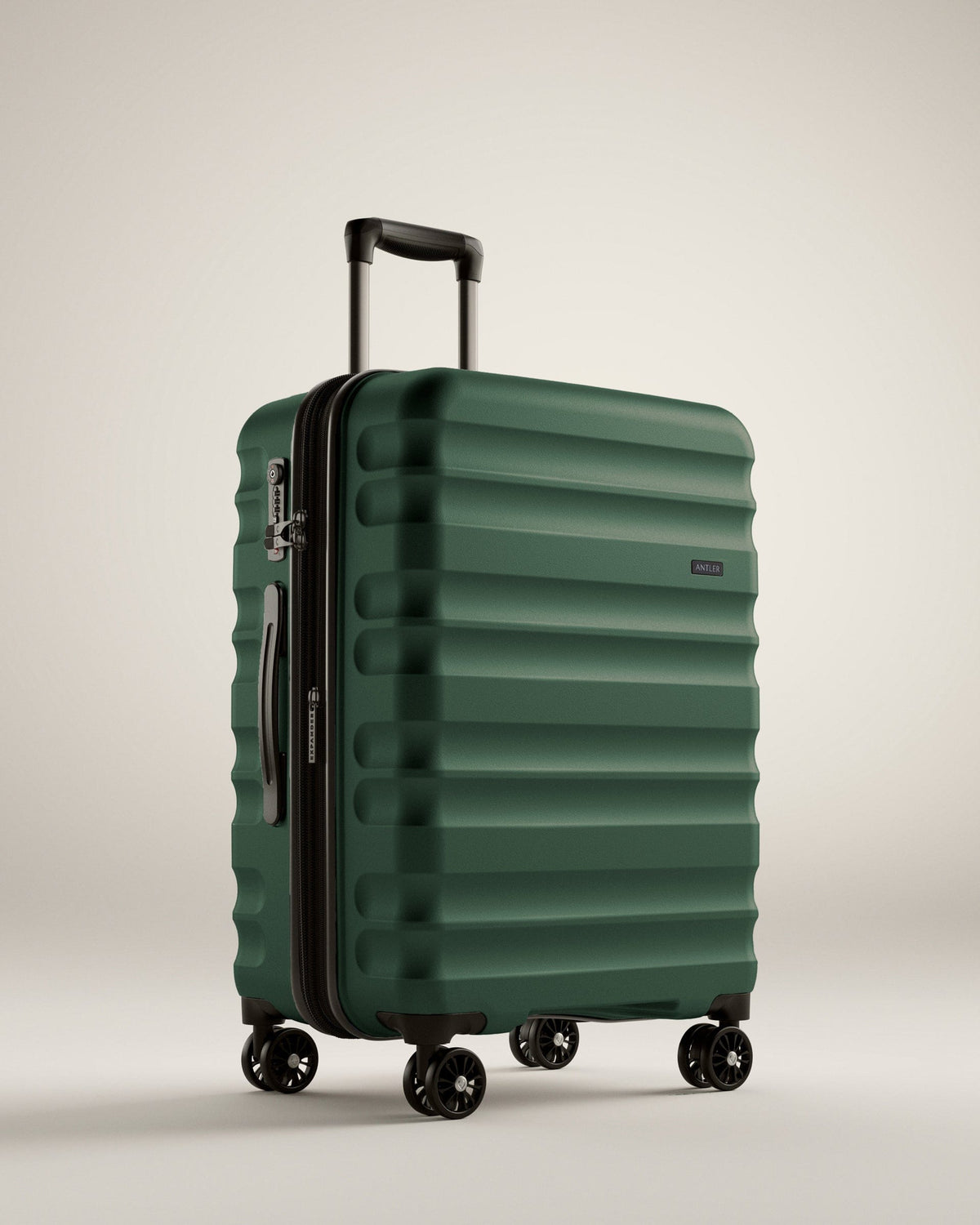 a green suitcase with wheels