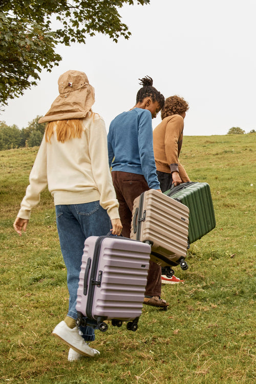 a group of people carrying luggage