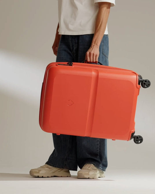 a person holding a suitcase