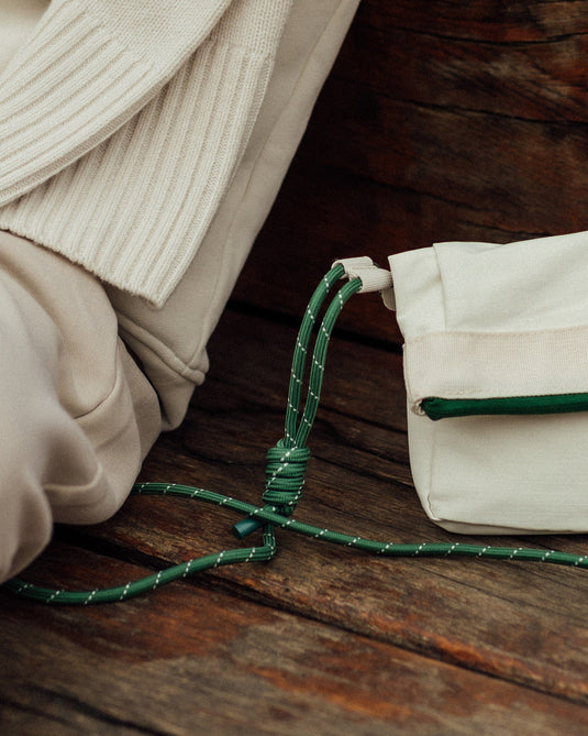 a green rope tied to a bag