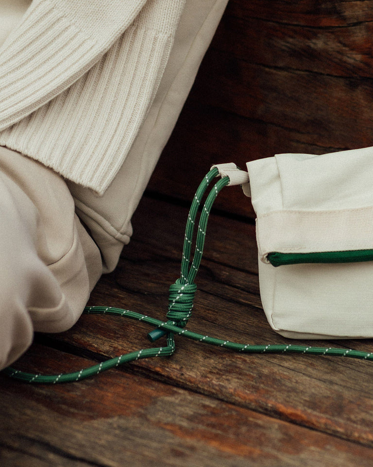 a green rope tied to a bag