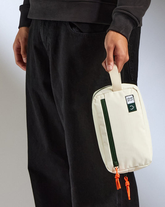 a person holding a white bag