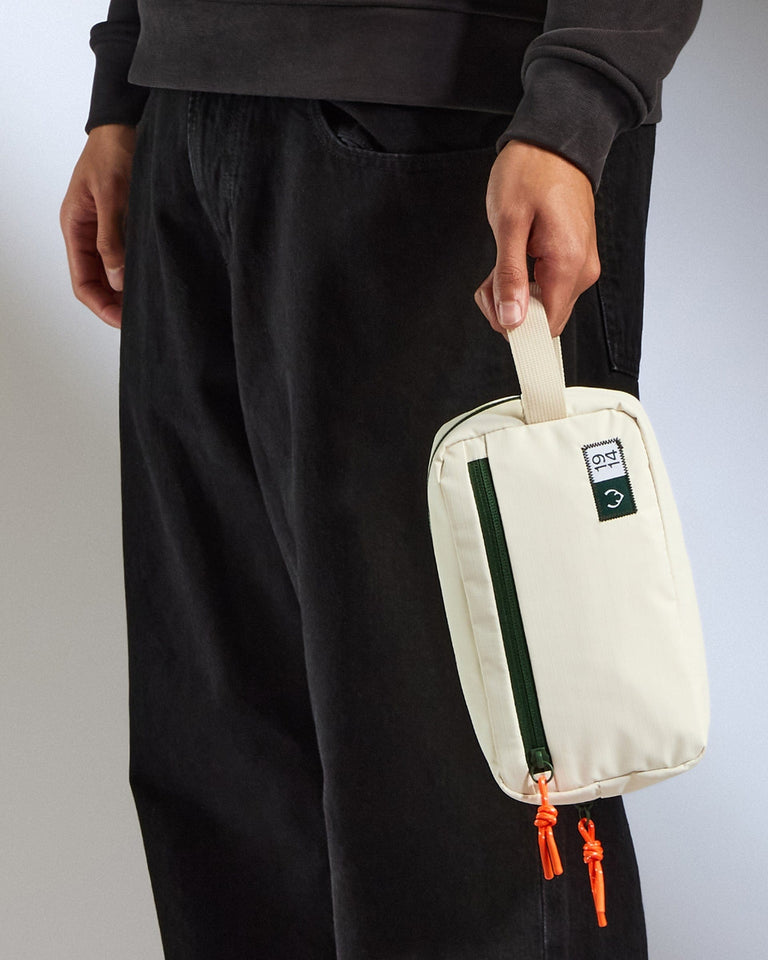 a person holding a white bag