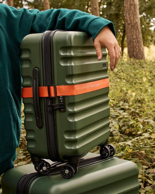 a person holding a suitcase