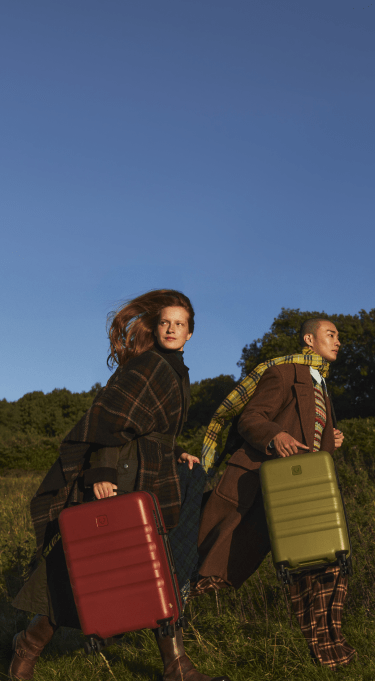 a man and woman with luggage