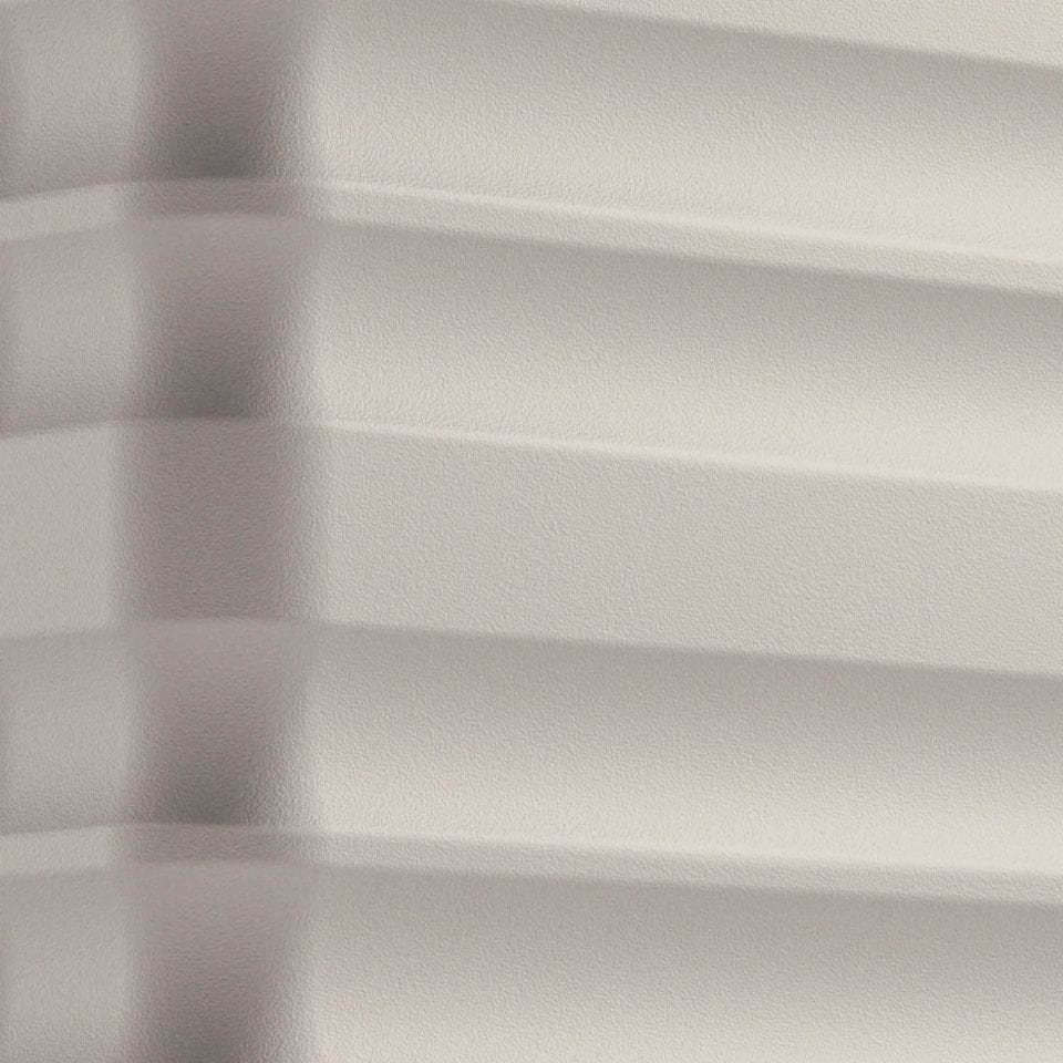 a close up of a white wall