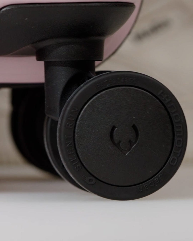 a black wheel on a suitcase