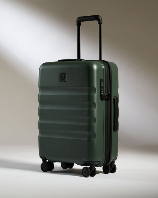 a green suitcase with wheels