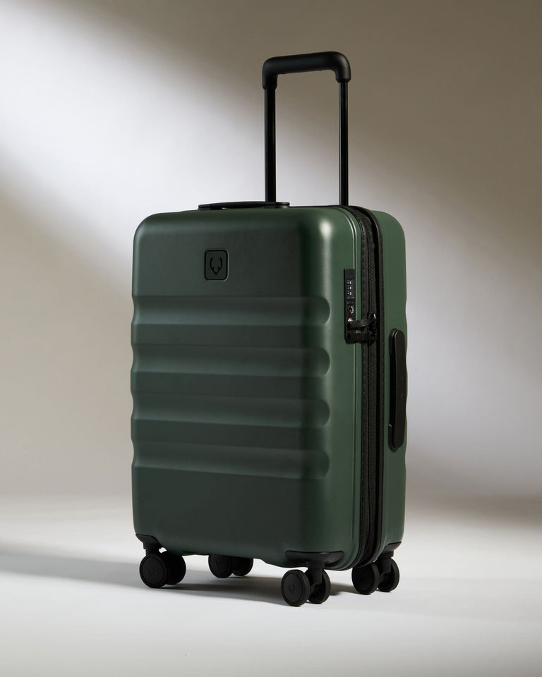 a green suitcase with wheels