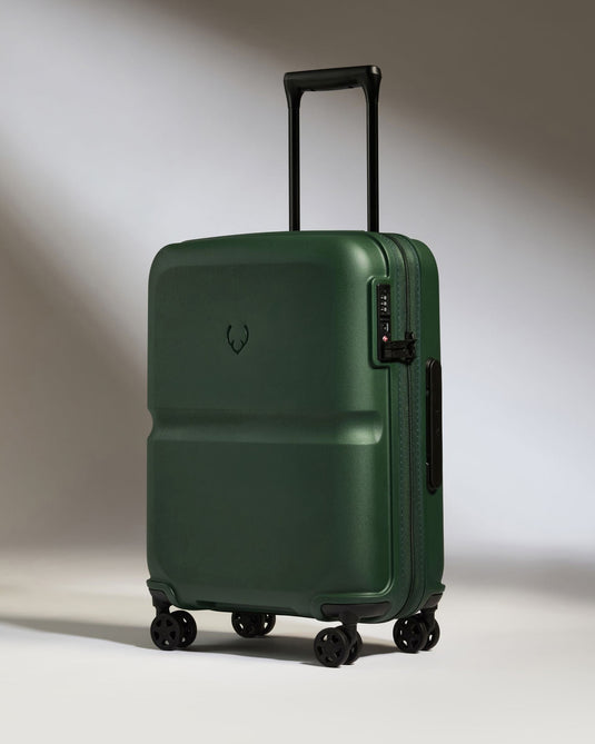 a green suitcase with wheels