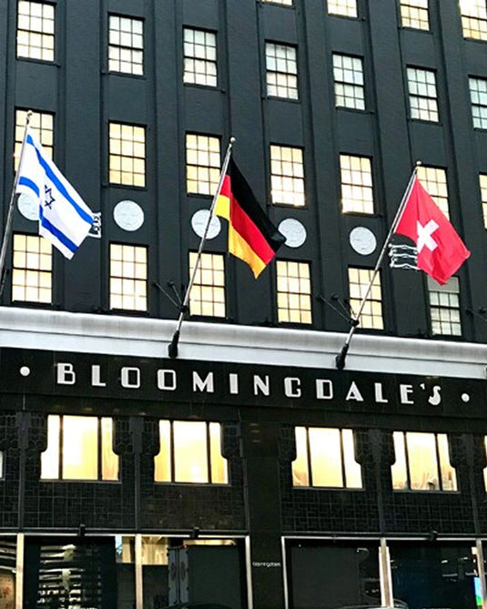 a group of flags on a building
