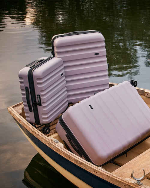 a group of luggage in a boat
