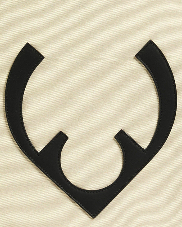 a black letter on a white surface