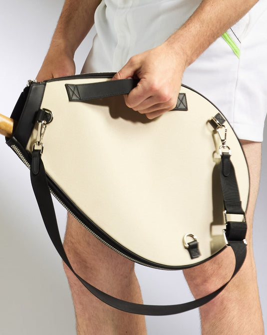 a person holding a tennis racket