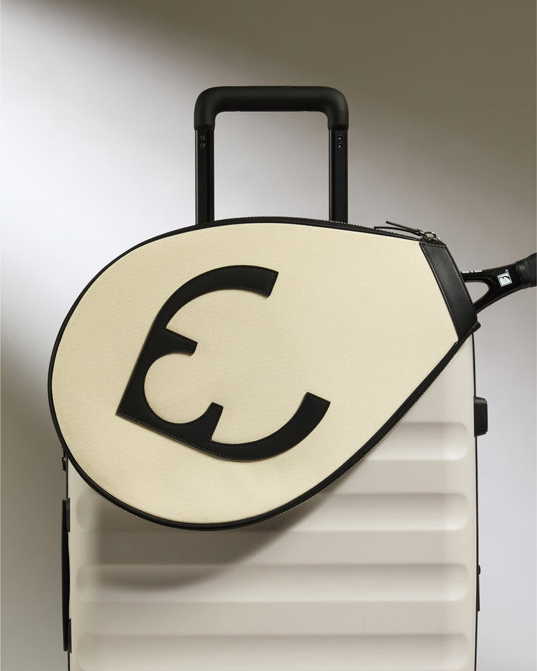 a white and black luggage bag