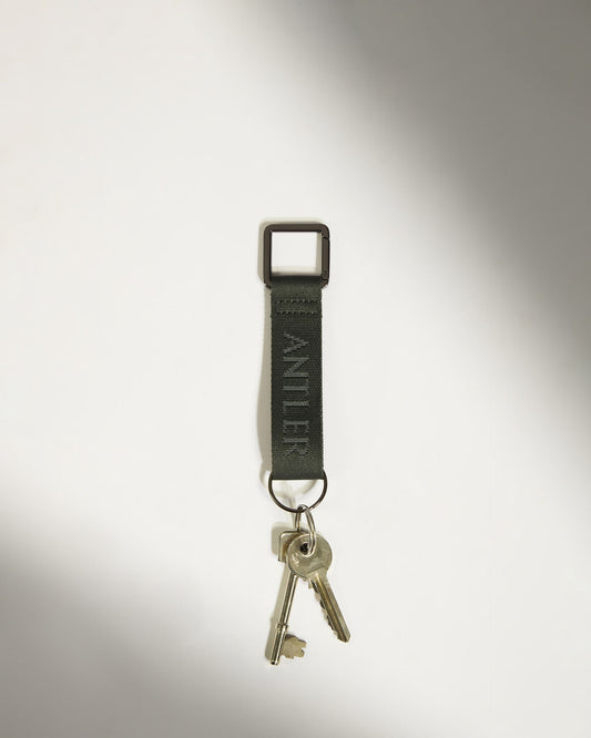 Antler Luggage -  Icon Keyring in Dark Khaki Green - Keyring Icon Keyring in Khaki Green | Keychain & Travel Bag Accessories