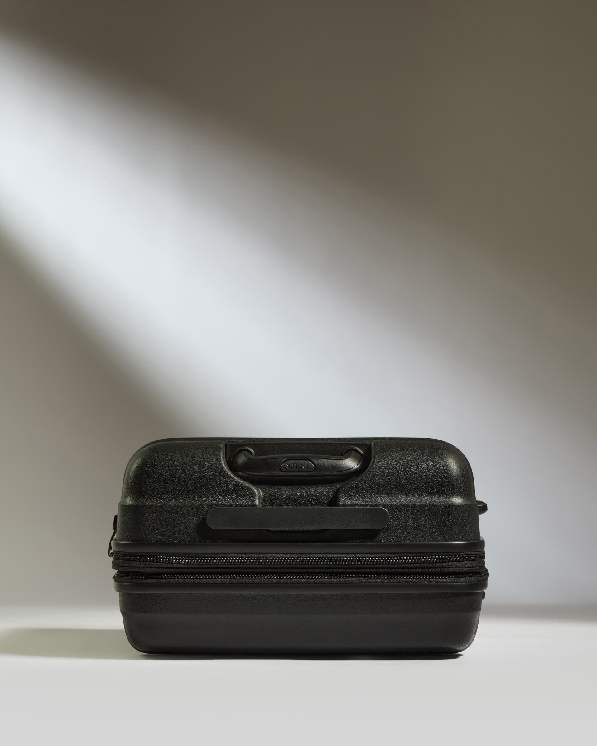 Antler Luggage -  Medium Suitcase in Black - Juno - Hard Suitcase Medium Suitcase in Black - Juno | Checked Luggage & Medium Suitcases