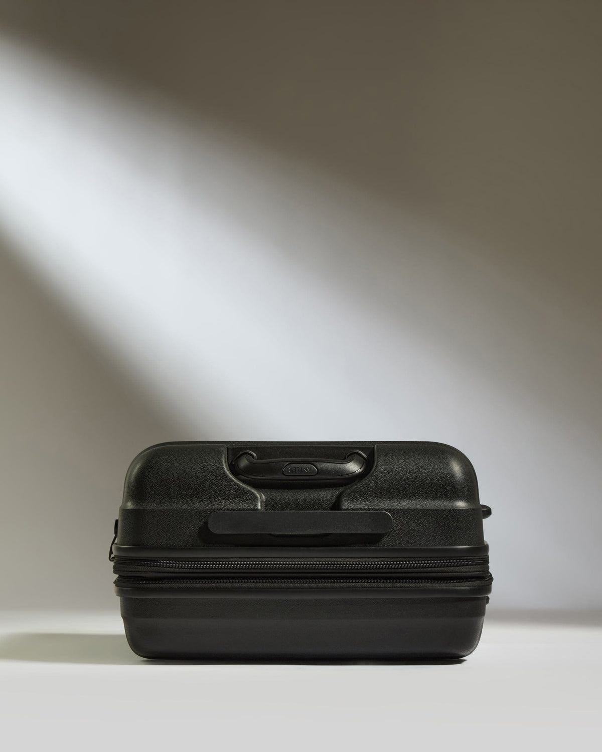 Antler Luggage -  Medium Suitcase in Black - Juno - Hard Suitcase Medium Suitcase in Black - Juno | Checked Luggage & Medium Suitcases