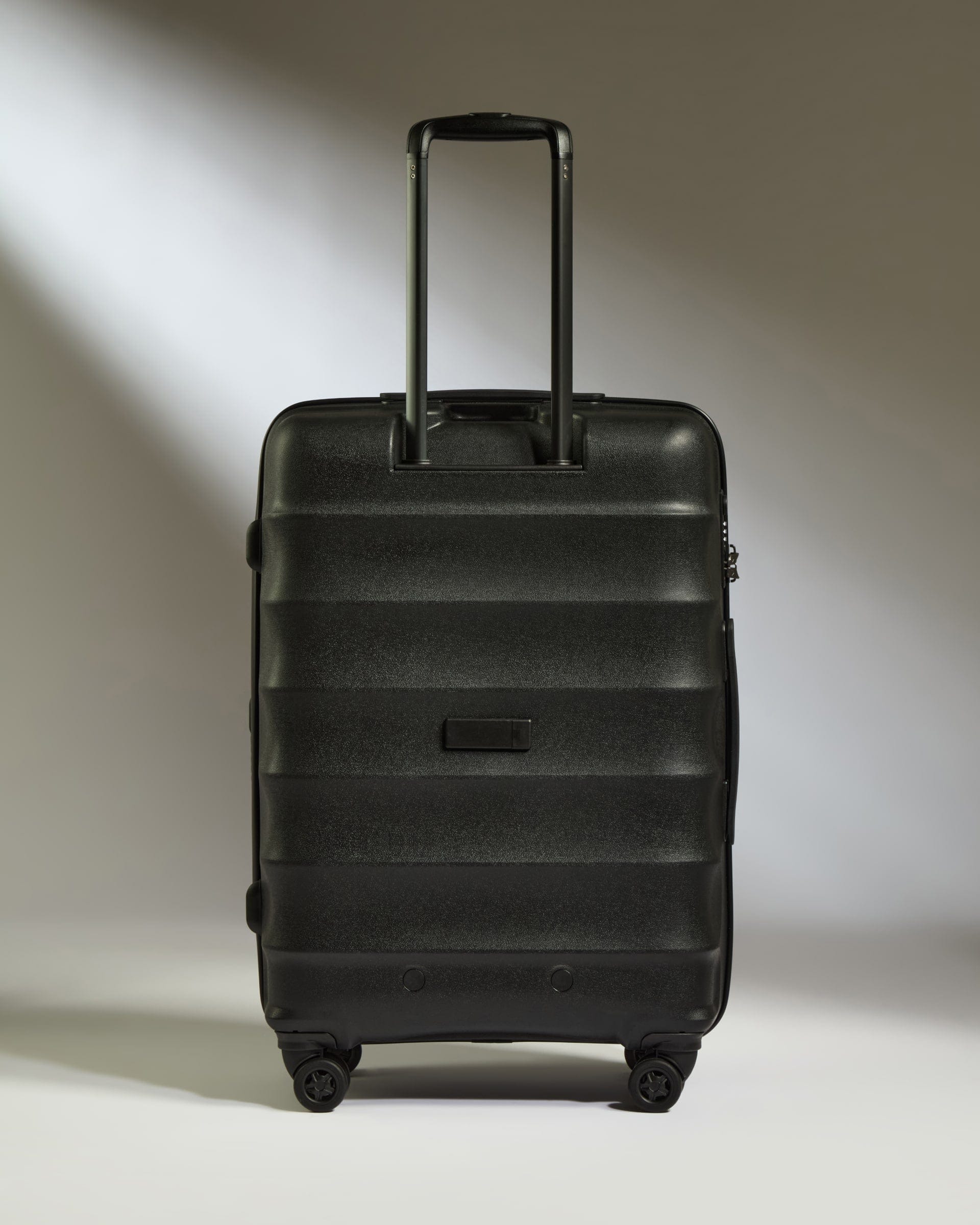 Antler Luggage -  Medium Suitcase in Black - Juno - Hard Suitcase Medium Suitcase in Black - Juno | Checked Luggage & Medium Suitcases