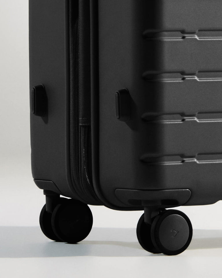 a black suitcase with wheels